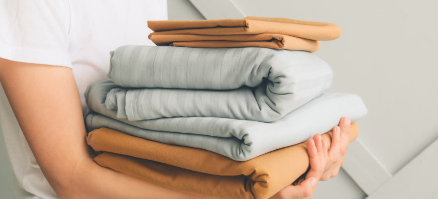 How do I fold fitted sheets?